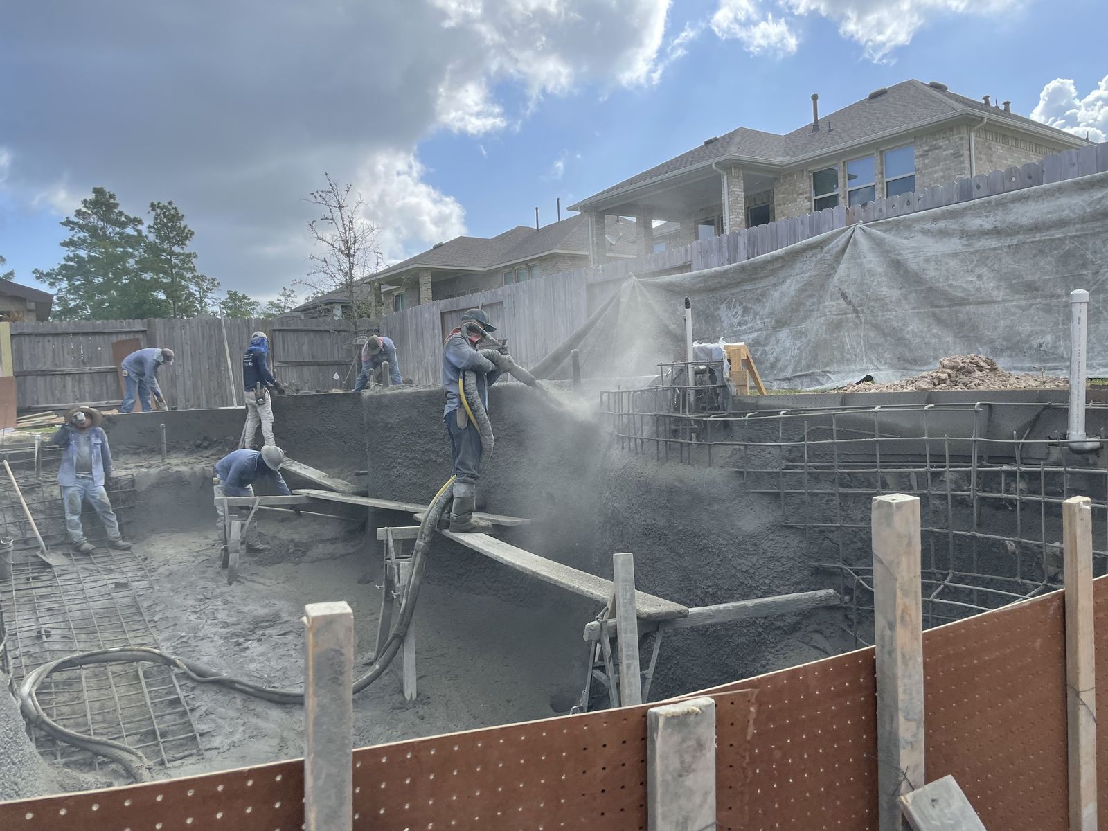 Shotcrete being sprayed to form the pool shell