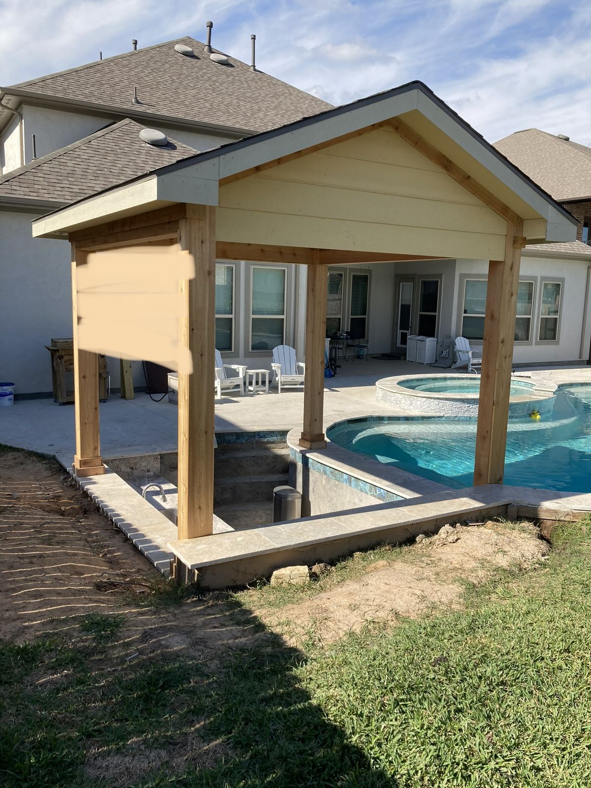 Cedar pergola going up over a swim-up bar